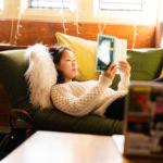 A trinity college student reading in their residence hall